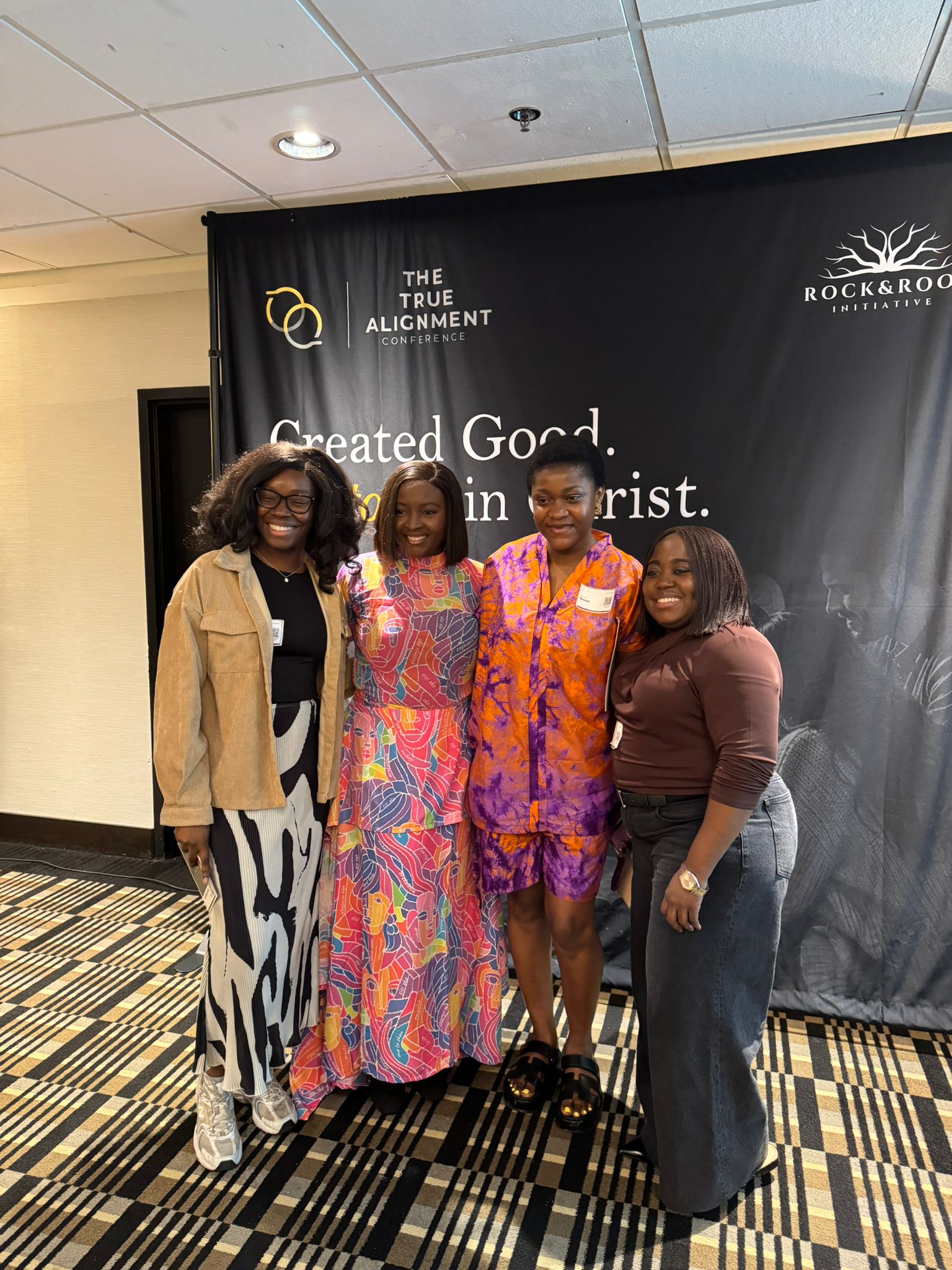 Group photo of four attendees