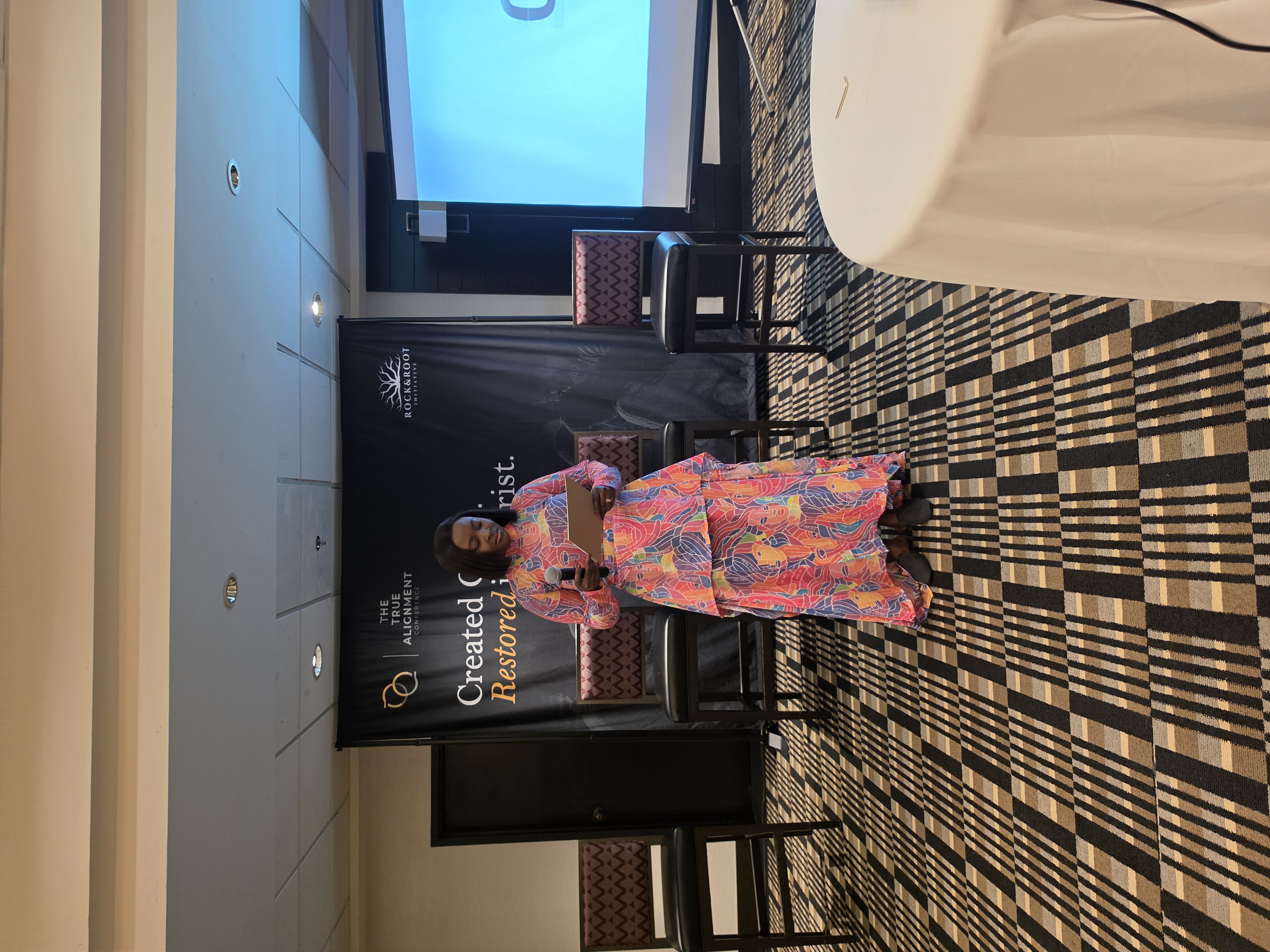 Titi Med sharing insights on stage